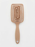 Brosse démêlante flexible beige, dos ajouré