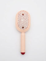 Brosse à cheveux rose poudré, côté picots